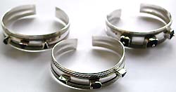 Sterling silver fashion bangle with assorted design lapis stone embedded in middle