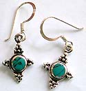 Celtic cross pattern sterling silver earring with rounded turquoise stone embedded in middle