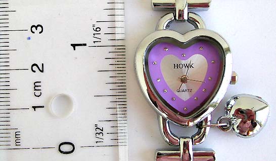 Fashion bracelet watch with heart shape clock face design and a heart love pattern 