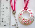 Fashion necklace in multi pinkish strings design with multi beaded carved-our double circle pendant