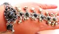 Fashion slave bracelet ring with multi black imitation stone and jingle bell pattern inlaid