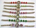 Assorted clock face design fashion bracelet watch with assorted design cat eye stone embedded on both sides, randomly pick by our warehouse stuff
