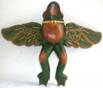 Green wooden flying frog