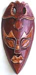 Bird top deep brown wooden mask with sharp chin and yellow decor on eyes and lips