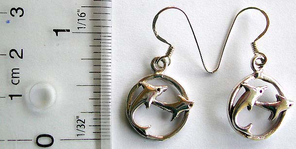 Sterling silver earring with fish hook and double dolphin in circle pattern suspending 
