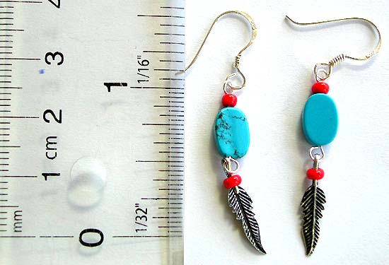 Sterling silver earring with 2 mini red beads and 1 oval shape blue turquoise bead holding a silver leaf pattern on bottom       
