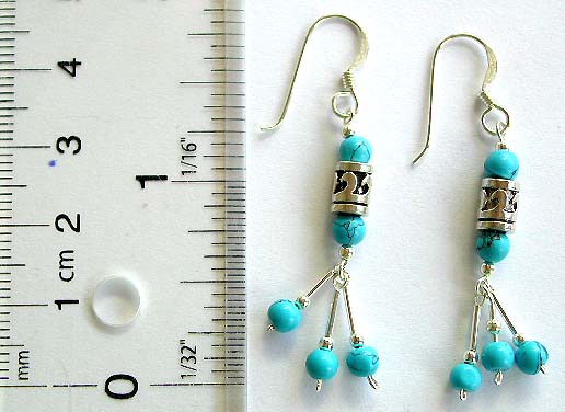 Sterling silver fish hook earring with 2 rounded turquoise beads and a Tibetan style spinning bead at center holding 3 beaded strips on bottom       
