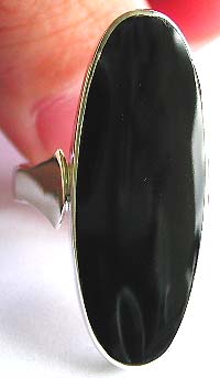 Sterling silver ring with a large elliptical shape black onyx stone in middle   