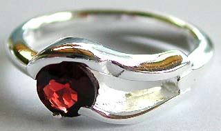 Sterling silver handmade jewelry, 925. sterling silver ring with carved-out double wavy pattern holding a rounded red garnet stone  

 
  



 
   