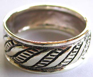 Sterling silver ring with multi carved-in mini wave pattern decor

 