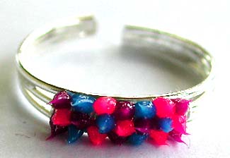 Triple bang sterling silver toe ring with multi color spiky-out beads at center                 

