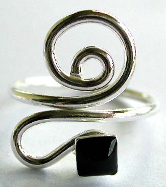 Sterling silver toe ring with curvy spiral pattern design holding a mini square shape black bead at center                 
