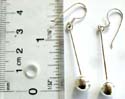 Fish hook silver earring with long strand hanging down and a round bead at the end,