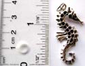 Sterling silver pendant in carved-out sea horse figure design