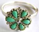Sterling silver ring with 6 water-drop shape green turquoise stone embedded flower pattern decor at center