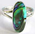 Sterling silver ring with carved-out V shape pattern holding an elliptical shape abalone seashell in middle