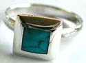 Sterling silver ring with a square shape blue turquoise inlay at center