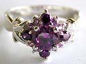 Sterling silver ring with multi purple cz stone forming flower pattern decor at center