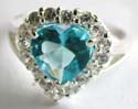 925. sterling silver ring with multi mini clear cz surrounding a heart shape blue cz stone at center