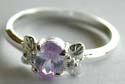 Butterfly pattern decor 925. sterling silver ring with an oval shape light / darl purple cz stone embedded in middle