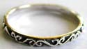 925. sterling silver ring with carved-out curvy pattern decor around 