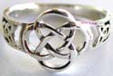 Sterling silver ring with carved-out Celtic knot work pattern decor at center