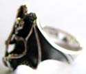 925. sterling silver ring with carved-out black flying seleton with stick pattern decor at center