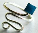 Curvy wave pattern design sterling silver toering holding a mini square shape blue bead at centeral top 