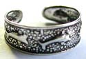 Black sterling silver toering with carved-out dot and dolphin pattern decor 