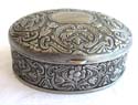 Elliptical fashion pewter jewelry box with carved-in flower pattern decor has a blue velvet liner to gently hold your precious jewelry 