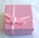 Pinkish sqaure ring display box with flower knot top decor 