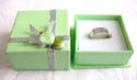 Green sqaure ring display box with silvery decorating string rose flower knot top decor