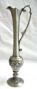 Silvery fashion vase stand with long narrow neck and floral pattern decor rounded central design, flower opening with handle