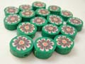 Rubber dark green bead with a large flower decor