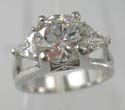 Fashion ring with clear cz stone lie in middle with mini clear cz on both sides, brass base and rhodium plated 