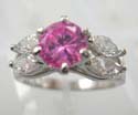 Fashion ring with rounded pink cz set in middle and two olive clear cz on each side, made brass base with rhodium plated 