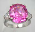 Oval pink cz stone ring with a clear cz embedded in heart shape aside in rhodium plated and brass base
