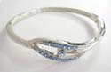 Fashion bangle with multi mini light blue cz synthetic stone embedded cut-out olive shape holding big rounded light blue cz in center