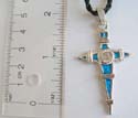 Fashion necklace with black twisted cord string holding a cross with blue enamel mental pendant at center