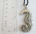 Black twisted cord string fashion necklace holding a sea horse feature mental pendant