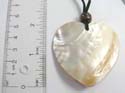 Fashion necklace with black suede string holding a heart-shaped seashell at center. Adjustable in all sizes