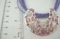 Fashion necklace with multi purple strings holding cut-out moon shape pendant with combination of assorted geometric purple cat eye beads and iridescent crystal embedded. Lobster claw clasp