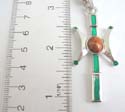 Fashion silver plated necklace holding a green enamel pendant with a rounded wood bead at center. Lobster clasp