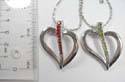 Fashion silver plated necklace holding cut-out heart pendant with a multi cz stone embedded wavy line pattern in middle. Lobster clasp