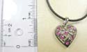 Fashion necklace with black thick cord string holding a heart pendant in cut-out floral design with multi mini pink cz stone embedded. Lobster clasp