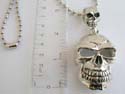 Fashion silver plated ball necklace holding two small and big skull head pendant feature at center