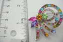 Fashion bow / ribbon pin features multi assorted cz stone in a sterling silver plate