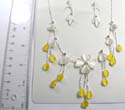 Fashion white cat eye beads dangling earring paired with silver plated necklace holding white cat eye beads flower and yellow cat eye beads dangle hanging 