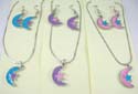 Fashion necklace and earring set. silver plated necklace holding moon and star enamel pendant paired with same design fish hook earring. Spring ring clasp