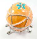 Enamel jewelry box motif an egg shape and green flower inlaid with white pearl beads line decor, enamel with orange color